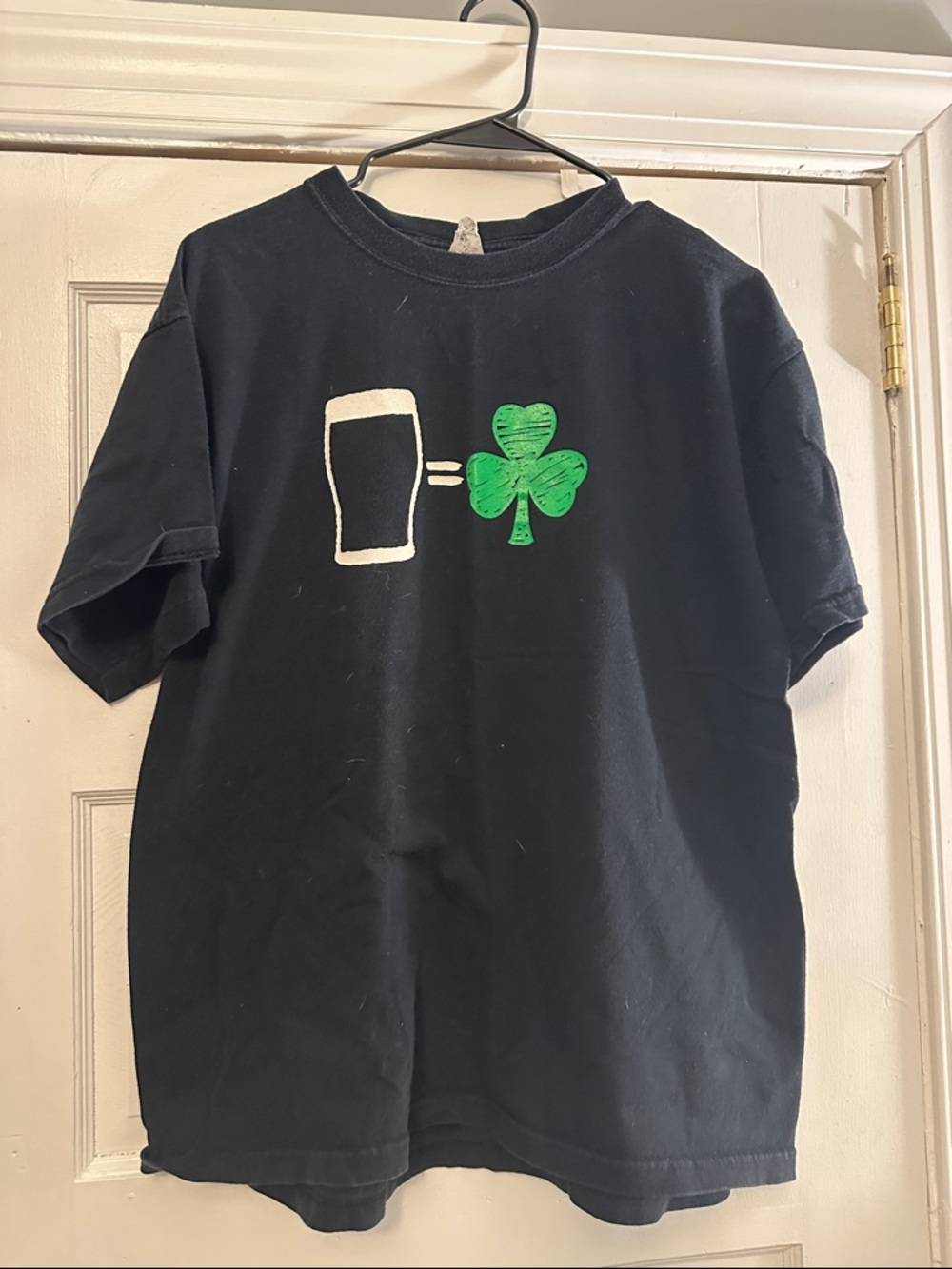 Black T-Shirt with Green Shamrock Graphic